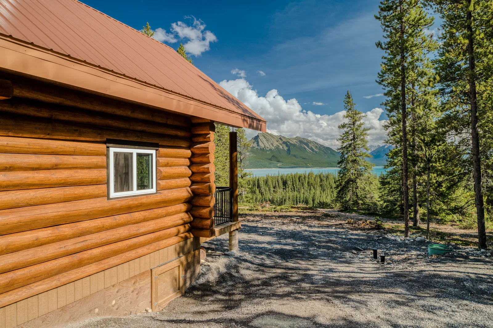 Handcrafted luxury log cabin among pine trees